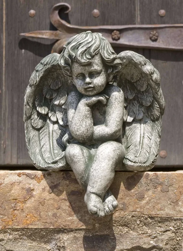 Campania International Aged Limestone Seated Cherub Small Statue